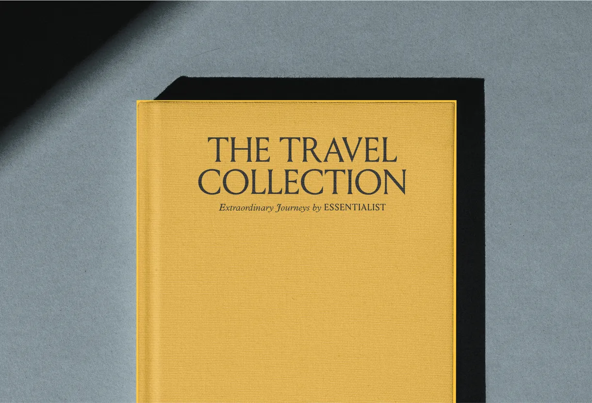 Hard cover of "The Travel Collection" by Essentialist, with dark characters over a yellow cover.